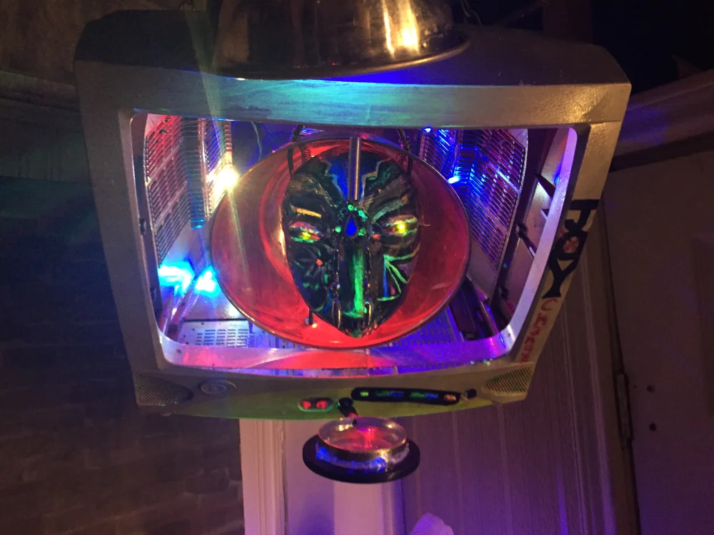 A lantern with a lit mask inside it